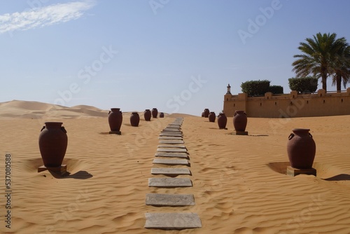 Sandy walk with stones in Qasr Al Sarab desert resort in Abu Dhabi, the United Arab Emirates photo