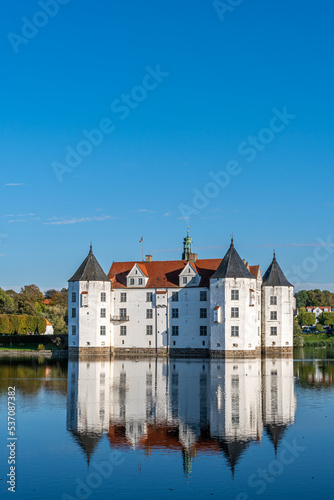 The beautiful Glücksburg Castle relfecting in the water.