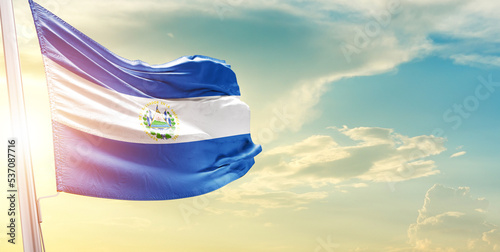 El Salvador national flag cloth fabric waving on the sky - Image