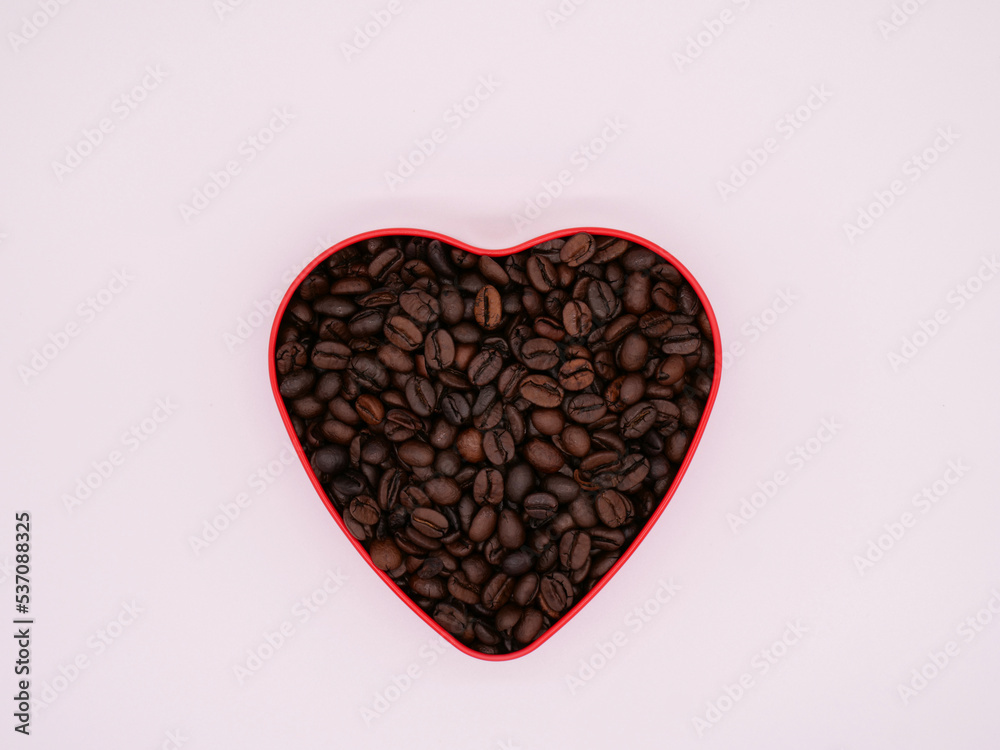 Coffee beans in the shape of a heart against a white background. copy space Coffee beans in the shape of a heart against a white background. copy space