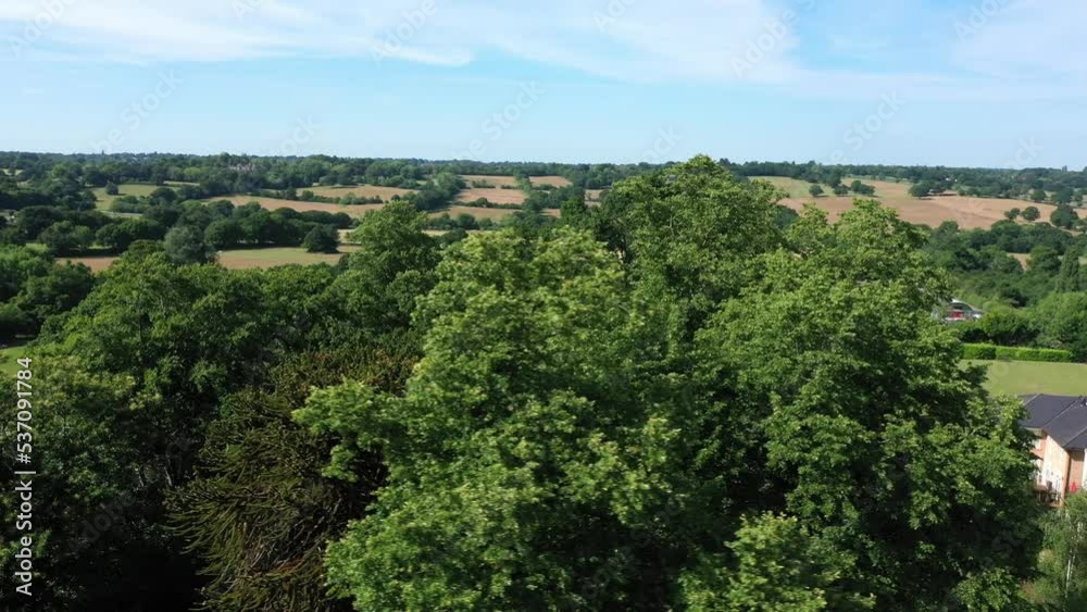 Aerial top down view from the drone on the narrow passageway leading to a small chapel. Chapel located in a big green open area of fields near Rosary Manor, Mill Hill, North West London, London, UK. Aerial top down view from the drone on the narrow passageway leading to a small chapel. Chapel located in a big green open area of fields near Rosary Manor, Mill Hill, North West London, London, UK.