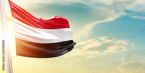 Yemen national flag cloth fabric waving on the sky - Image photo