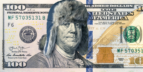 Energy crisis and money, 100 dollar bill with winter hat, president feeling cold photo