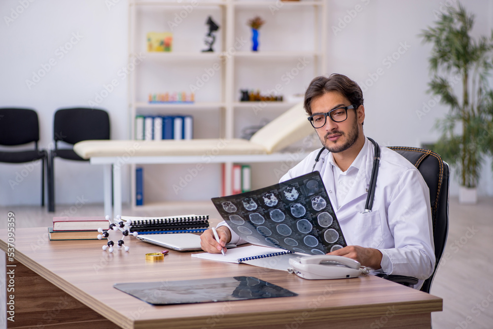 Fototapeta premium Young male doctor radiologist working in the clinic