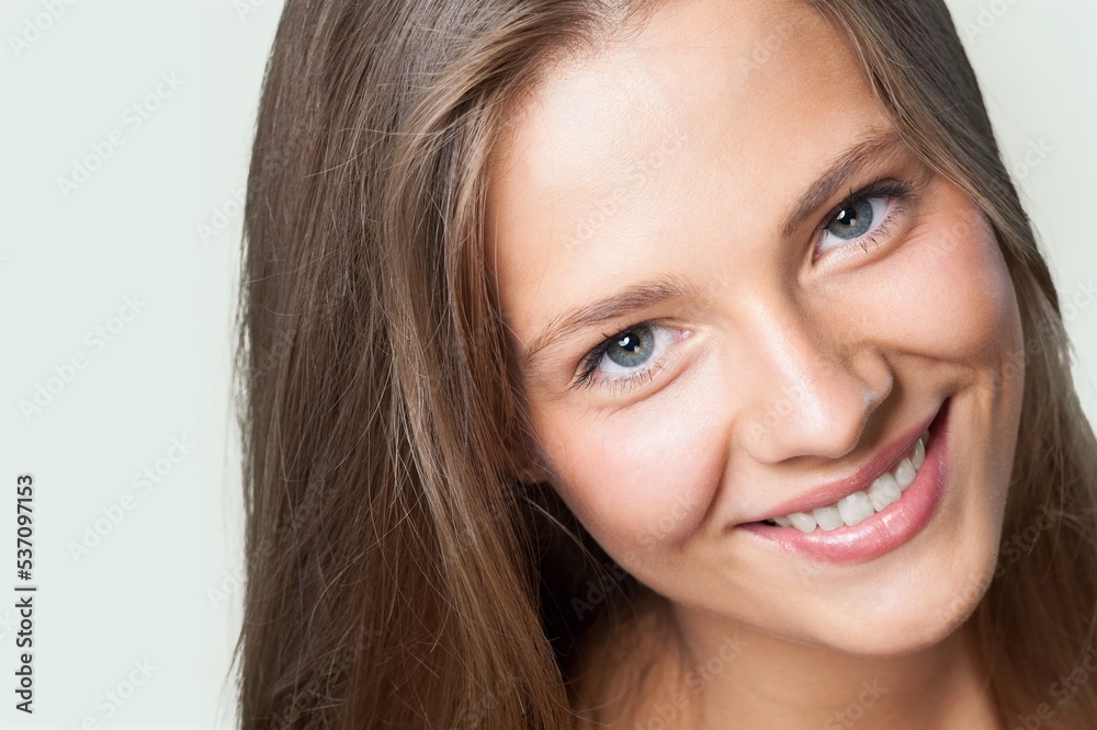 Smiling woman feeling happy and posing on background Smiling woman feeling happy and posing on background