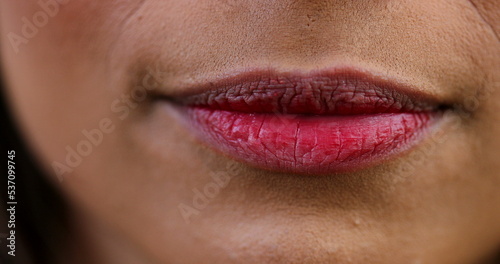 Woman wearing red lipstick macro close-up
