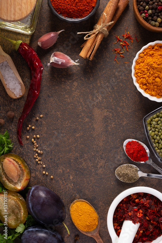 Variety of spices and herbs at table background. Cooking concept and ingredients on table