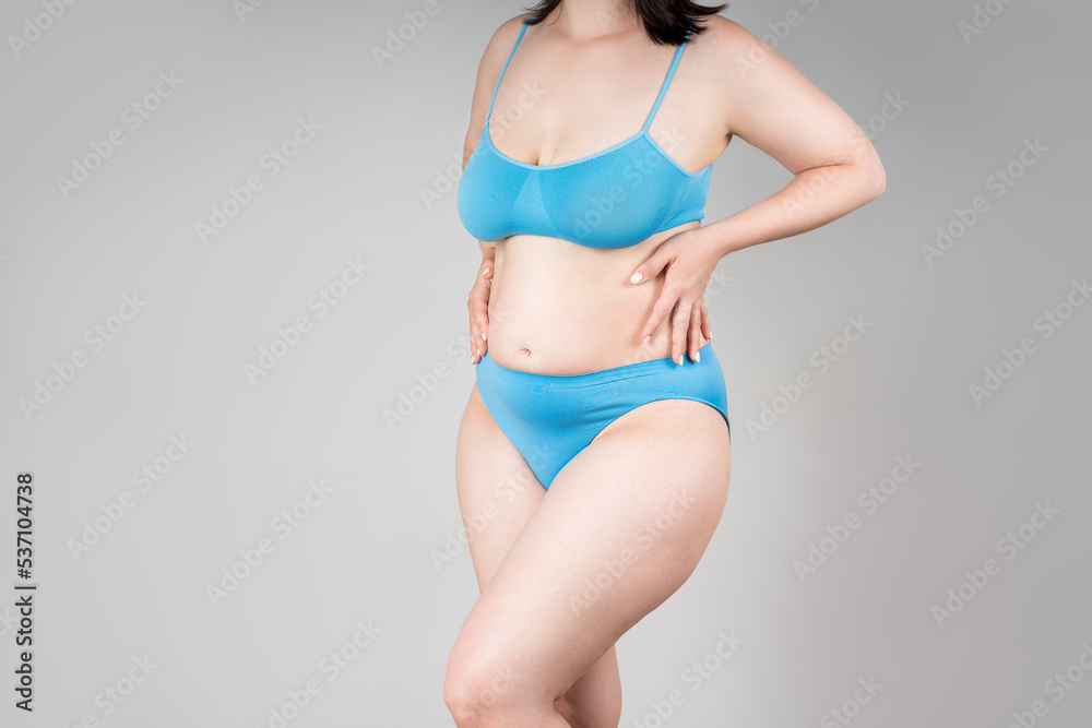 Fat woman in blue underwear on gray background, overweight female body  Photos | Adobe Stock