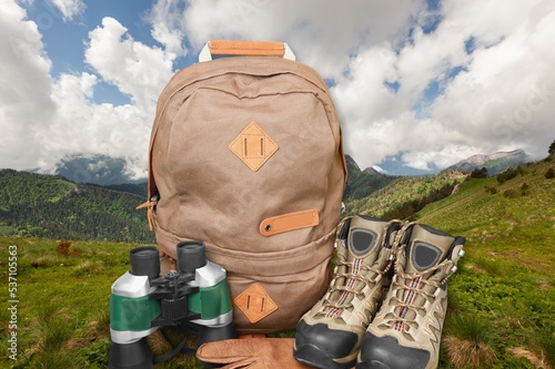 Hiking equipment with boots on the nature outdoor