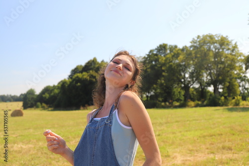 portrait of a cute girl in the field