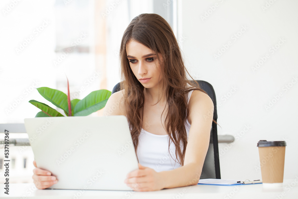 Business woman busy working on laptop computer at office. Business woman busy working on laptop computer at office.