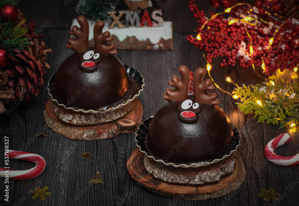 Chocolate deer cakes on wooden cuts.