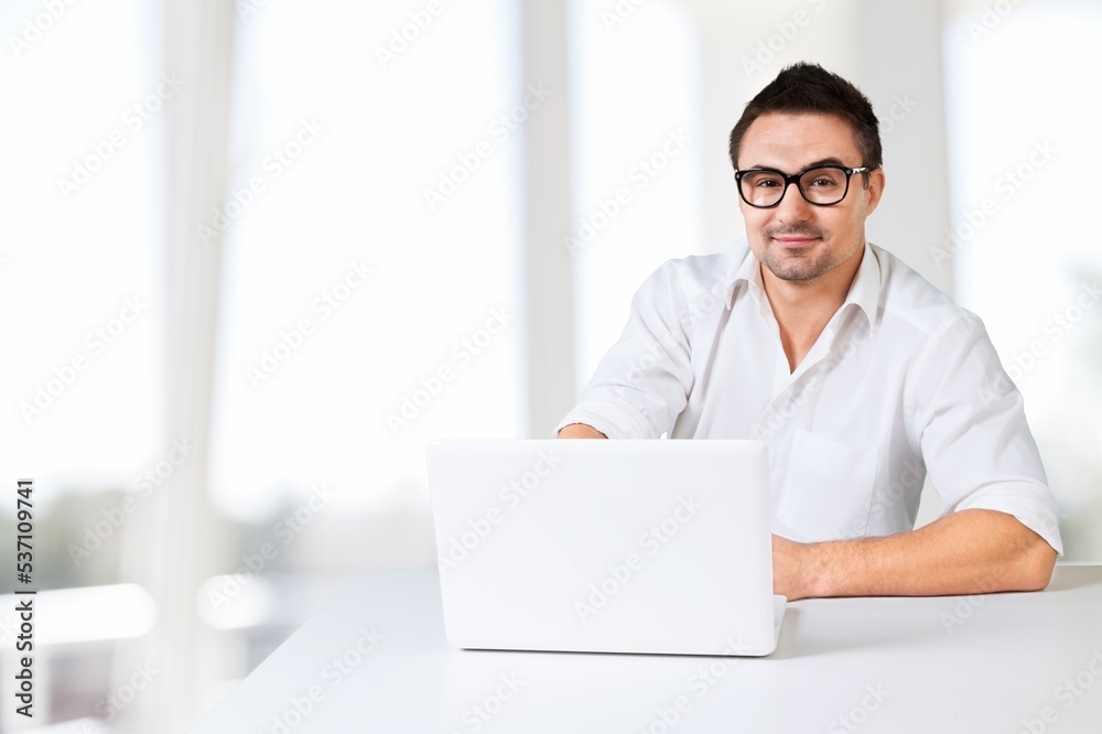 Young worker man at the table use computer Young worker man at the table use computer