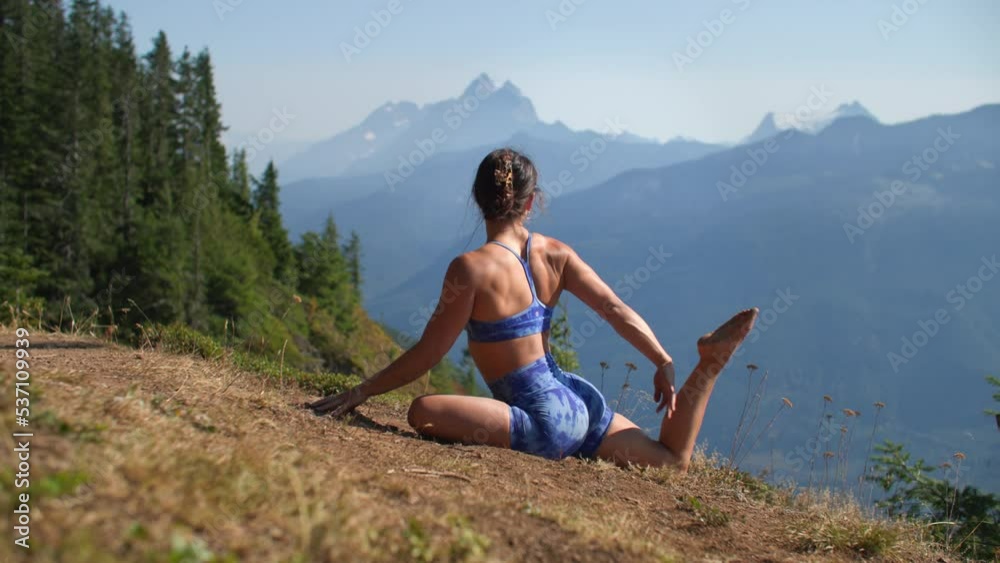 Fit young beautiful girl doing yoga in nature, mermaid pose Fit young beautiful girl doing yoga in nature, mermaid pose