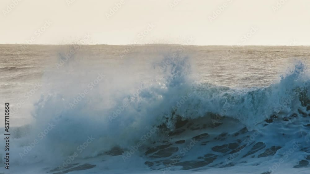 Stormy ocean wave breaks on the shore at sunrise. Powerful Atlantic Ocean Stormy ocean wave breaks on the shore at sunrise. Powerful Atlantic Ocean