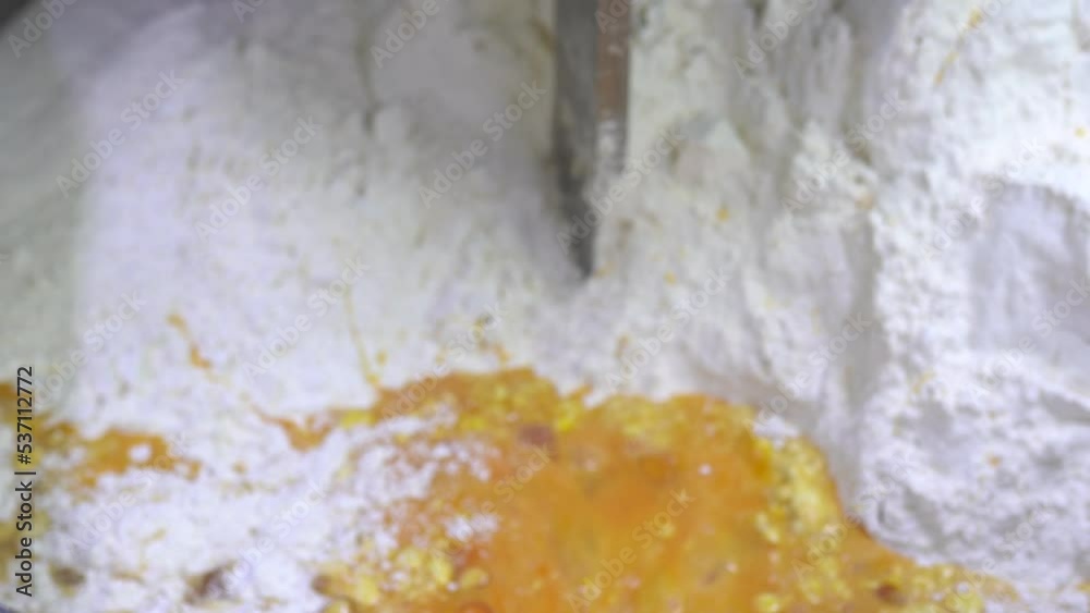 Cake dough making. Machine knead bread dough. Raw dough in a industrial bakery dough mixer, food concept. Stock footage. 4K resolution video. Cake dough making. Machine knead bread dough. Raw dough in a industrial bakery dough mixer, food concept. Stock footage. 4K resolution video.