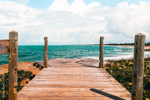Fototapeta Naklejka Na Ścianę i Meble -  Peacefull wooden bridge on the coast with nice views from Puerto Rico Piñones la posita beach 