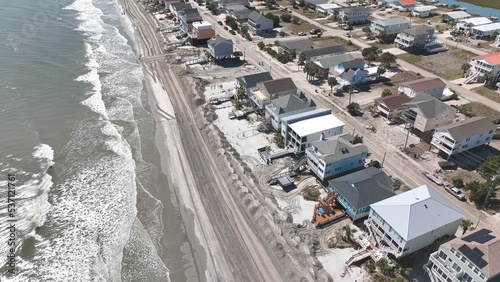 Damage to vacation homes, property and beach erosion from Hurricane Ian storm surge in Surfside Garden along South Carolina coastline 