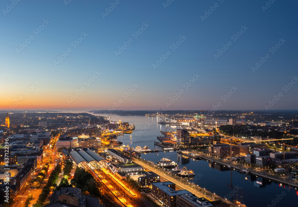 Beautiful aerial night cityscape of Kiel (Schleswig-Holstein, Germany) at blue hour 