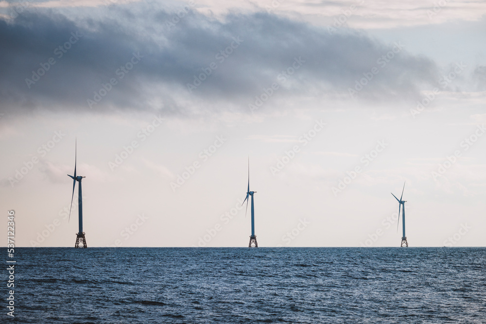 Three wind turbines out to sea for renewable energy