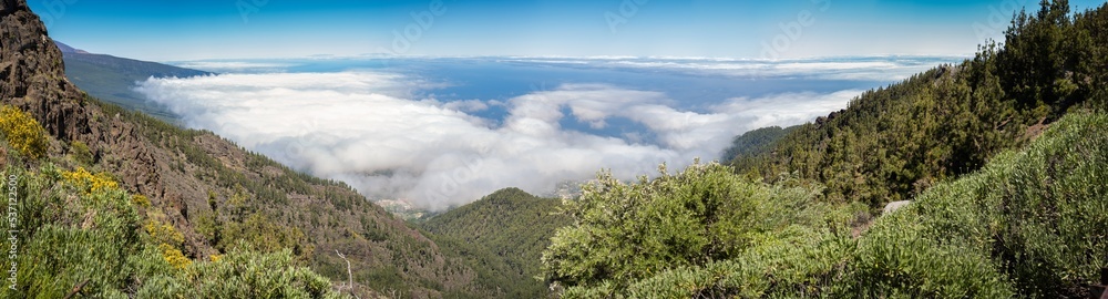 Incredible sea of ​​clouds landscape from the side of a cliff