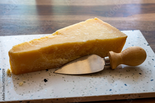 Italian cheese collection, piece of old matured grana padana cheese made from cow milk in Italy