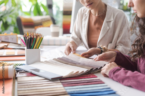 Interior designers checking fabric swatches