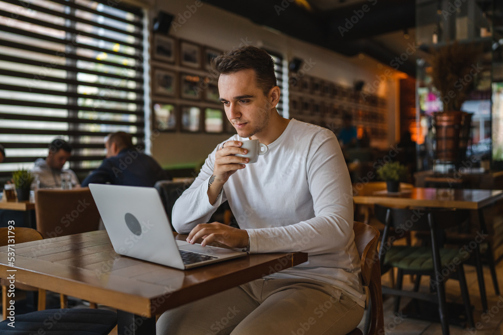 one man work on laptop computer at cafe with bad news worried one man work on laptop computer at cafe with bad news worried