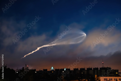Soyuz space rocket launch. Space jellyfish in sky. Plume of rocket gases in sun at dawn.