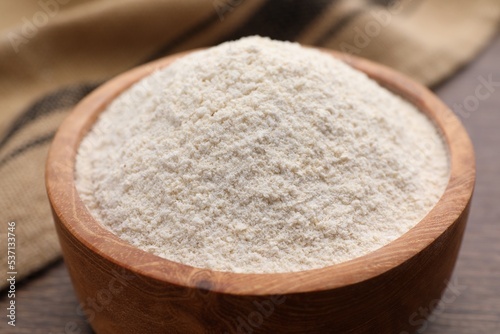 Quinoa flour in bowl on table, closeup
