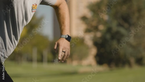 Closeup Disc Golf Tee Shot on Discgolf Course in slow motion photo