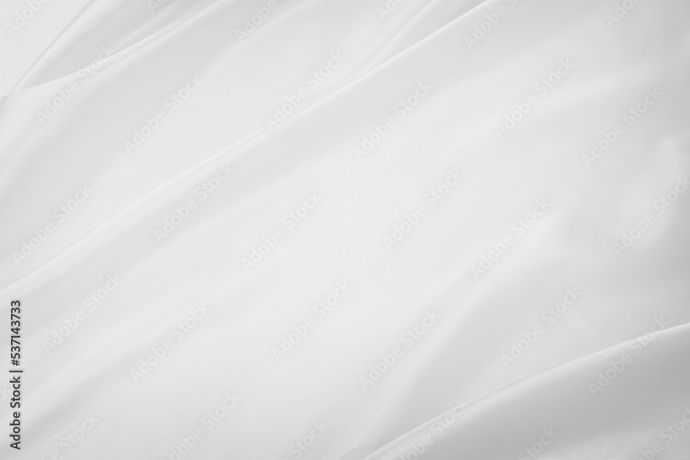 ドレープのあるシルクの白い布の背景テクスチャー