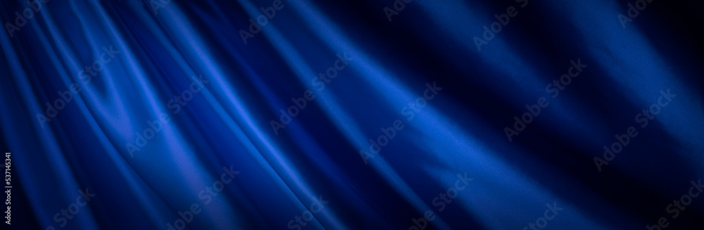 Fototapeta premium ドレープのある青い布地の背景テクスチャー