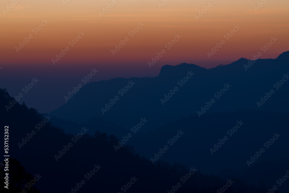 Background of colorful sky concept: Dramatic sunset with twilight color sky and clouds