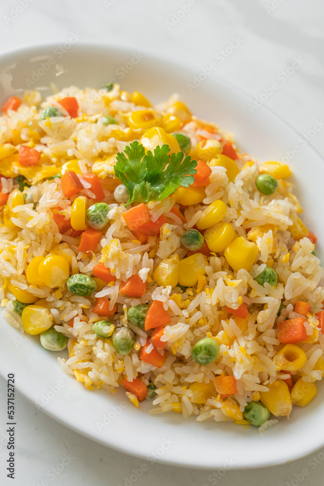 fried rice with mixed vegetable (carrot, green bean peas, corn) and egg fried rice with mixed vegetable (carrot, green bean peas, corn) and egg