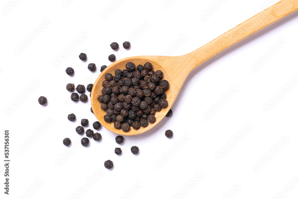 Black peppercorns (black pepper) in wooden spoon isolated on white background. Top view, flat lay. Black peppercorns (black pepper) in wooden spoon isolated on white background. Top view, flat lay.