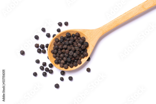 Black peppercorns (black pepper) in wooden spoon isolated on white background. Top view, flat lay.
