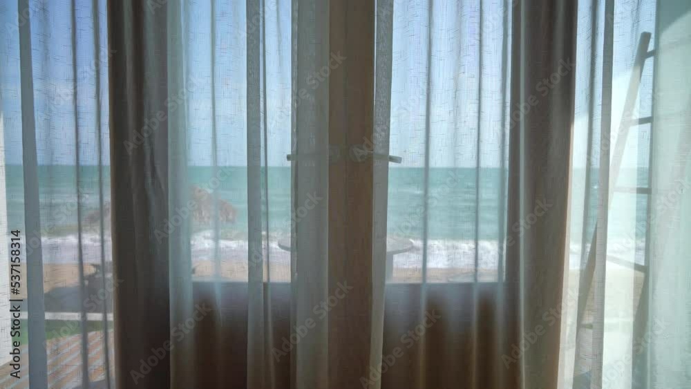 curtain and window with sea beach outside view