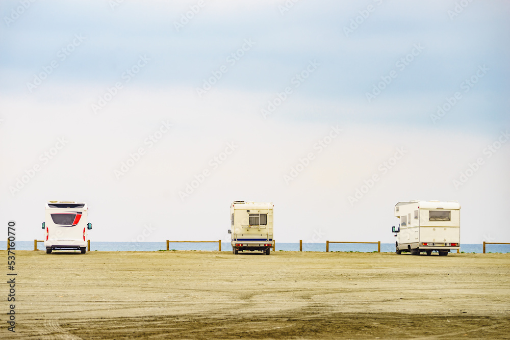 Campers camping on sea coast in Spain