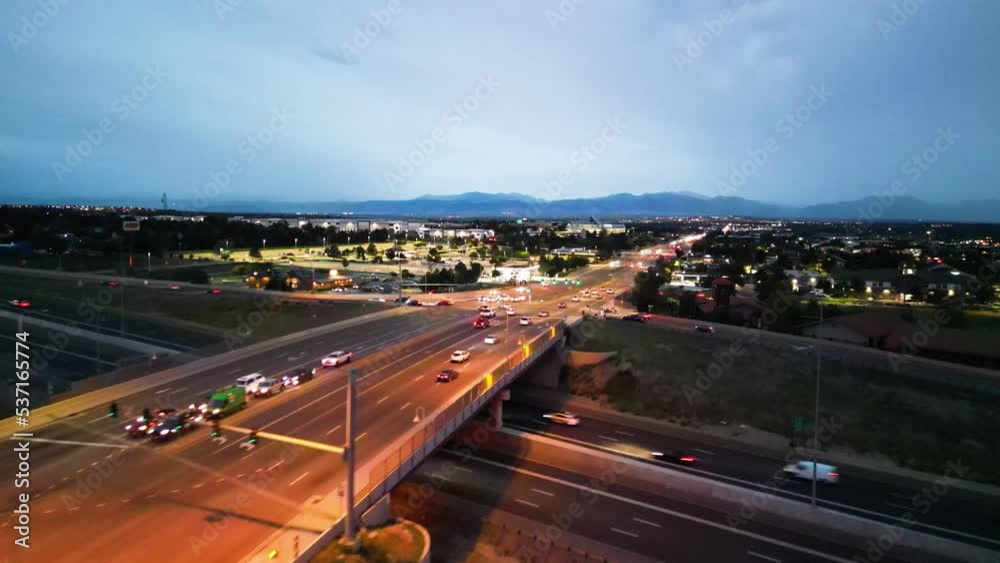 Evening Traffic Along Highway Intersections And Overpass Bridge With Fast Moving Cars In Denver, Colorado, USA. - Aerial Tracking Shot