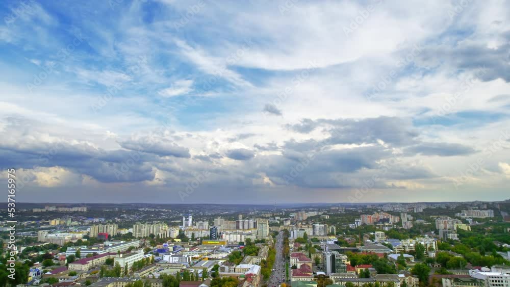 Aerial drone view of Chisinau downtown, Moldova. View of multiple residential and office buildings, a lot of greenery, moving cars, cityscape Aerial drone view of Chisinau downtown, Moldova. View of multiple residential and office buildings, a lot of greenery, moving cars, cityscape