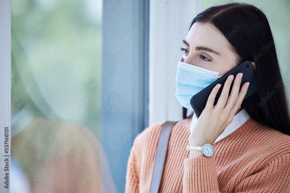Covid, face mask and smartphone with woman on a phone call for healthcare, compliance and corona virus information in her home for safety. Sad business woman talking on cellphone for insurance policy Covid, face mask and smartphone with woman on a phone call for healthcare, compliance and corona virus information in her home for safety. Sad business woman talking on cellphone for insurance policy