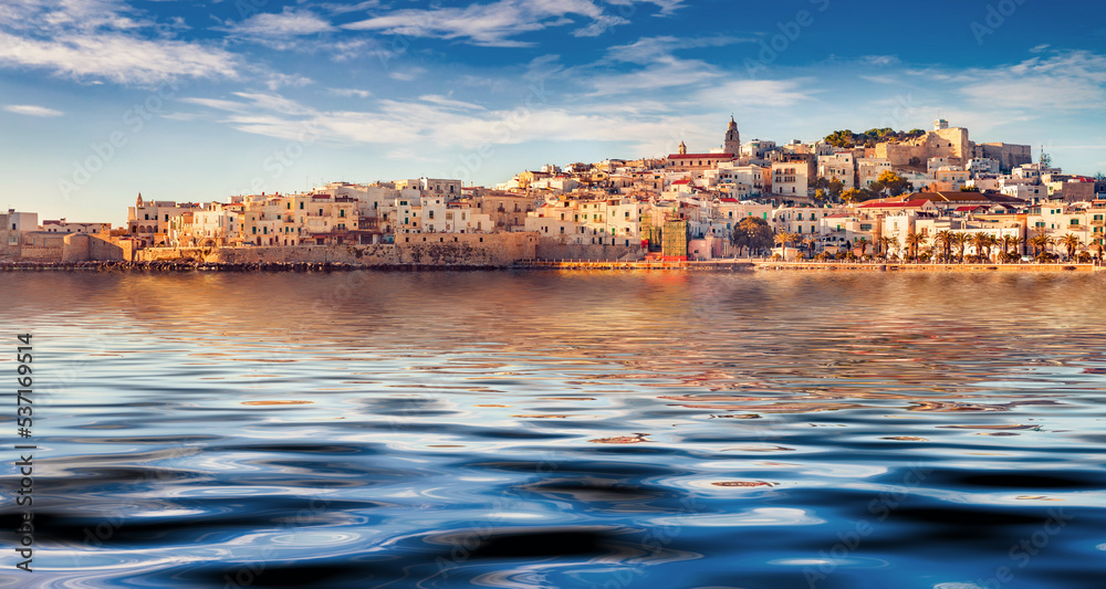 Vieste town reflected in the calm waters of Adriatic sea, Gargano National Park. Picturesque summer scene of Apulia, Italy, Europe. Traveling concept background.