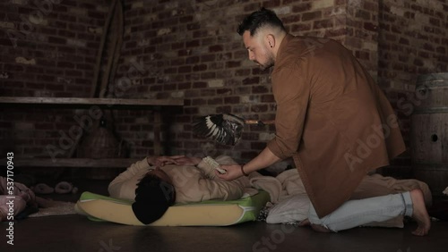 Holistic Shaman burning White Sage Smudging in Energy Cleanse Ritual Ceremony Slow Motion