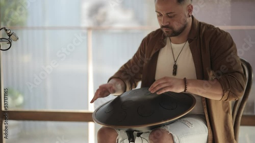 Yong Man Playing Handpan Shaman during Sound Healing Ceremony Slow Motion Musician Performing