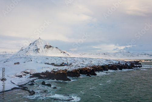 Arnarstapi , Beautiful fishing village buildings and nature near Mt. Stapafell during winter snow everning at Arnarstapi , Snæfellsnes peninsula in Iceland : 15 March 2020