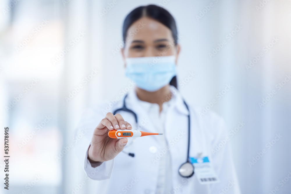 Thermometer, covid and doctor with digital results of fever while working in a hospital. Portrait of a nurse, medical worker and surgeon with reading from tech for safety from virus with a face mask Thermometer, covid and doctor with digital results of fever while working in a hospital. Portrait of a nurse, medical worker and surgeon with reading from tech for safety from virus with a face mask
