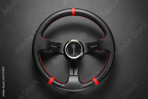 Sport car steering wheel top view background. © Dmitriy