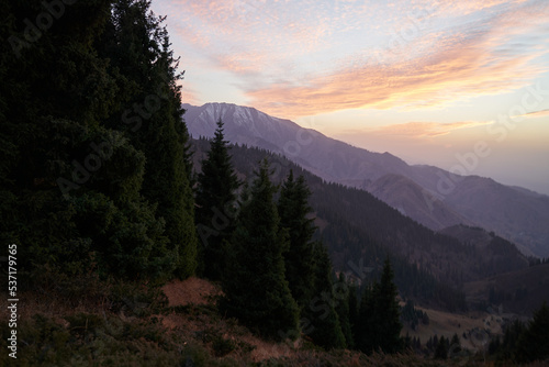 Evening landscape in the mountains with a beautiful sunset sky.