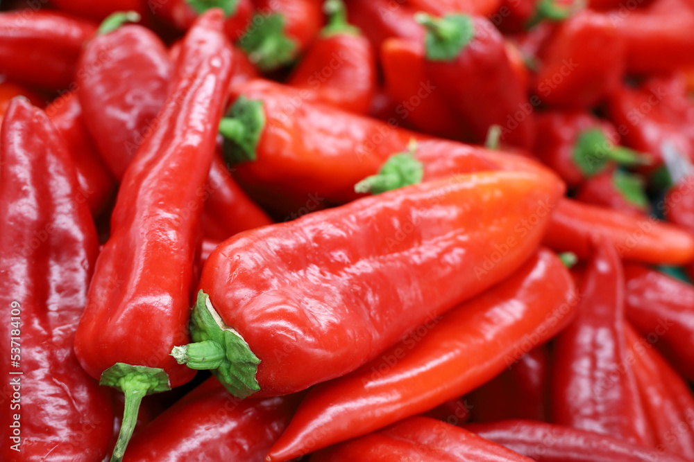 Ramiro pepper close up. Red sweet peppers on a market, paprika, vegetable background
